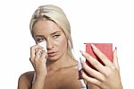 Young Woman Clean Face With Wet Wipes And Holding Mirror Stock Photo