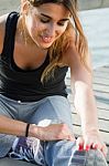 Young Woman Doing Push Ups Near The Sea Stock Photo