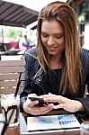 Young Woman Enjoying At Cafe Stock Photo