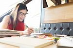 Young Woman Enjoying Reading Book Sitting Near Window Relaxing I Stock Photo