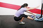 Young Woman Exercising On Gym Stock Photo