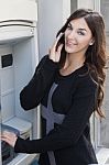 Young Woman Holding A Tablet On The Street Stock Photo