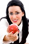 Young Woman Holding An Apple Stock Photo