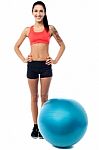 Young Woman In Gym Wear With Exercise Ball Stock Photo