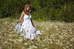 young Woman In Meadow Stock Photo