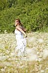 Young Woman In Meadow Stock Photo