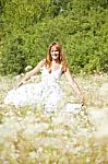 Young Woman In Meadow Stock Photo