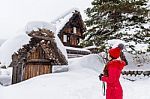 Young Woman In Shirakawa-go Village In Winter, Unesco World Heritage Sites, Japan Stock Photo