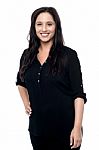 Young Woman In Studio Looking At Camera Stock Photo