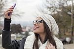 Young Woman Looking At Mobile Phone Stock Photo