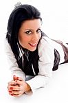 Young Woman Lying Down On Floor Stock Photo