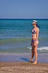 Young Woman On The Beach Stock Photo