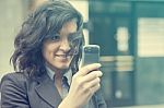 Young Woman Photographing With Cell Phone Stock Photo