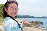 Young Woman Photography Near The Sea Stock Photo