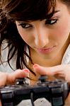 young Woman Playing Video game Stock Photo