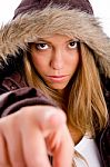 Young Woman Pointing Forward Stock Photo