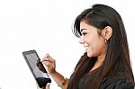 young Woman pressing Tablet PC Stock Photo