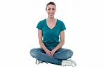 Young Woman Sitting On The Floor Stock Photo