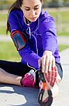 Young Woman Stretching And Preparing For Running Stock Photo