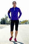 Young Woman Stretching And Preparing For Running Stock Photo