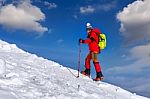 Young Woman Taking Photo With Smartphone On Mountains In Winter Stock Photo