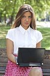 Young Woman Using Laptop Stock Photo