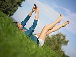 Young Woman Using Laptop In Park Stock Photo