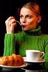 Young Woman With A Spoon In Her Mouth Making Breakfast With A Cu Stock Photo