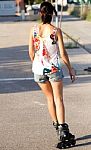 Young Woman With Roller Skate Riding In The Park Stock Photo