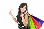 Young Woman With Shopping Bags And Credit Card Stock Photo