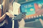 Young Woman With Tablet Computer Walking On Street Stock Photo