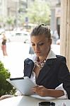 Young Woman With Tablet Out In The City Stock Photo