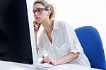 Young Woman Working From Home On The Computer And Talking On The Stock Photo