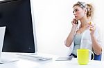 Young Woman Working From Home On The Computer And Talking On The Stock Photo