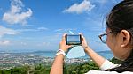 Young Women Taking Photograph With Mobile Phones Stock Photo