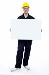 Young Worker Holding Blank Board Stock Photo