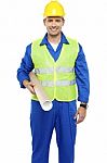 Young Worker Holding Blueprint Stock Photo