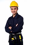 Young Worker Wearing Yellow Hard Hat Stock Photo