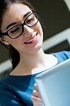 Young Worker Woman With Digital Tablet In Her Office Stock Photo