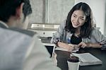 Younger Woman Paper Working On Coffee Table With Boy Friend With Happiness Emotion Stock Photo